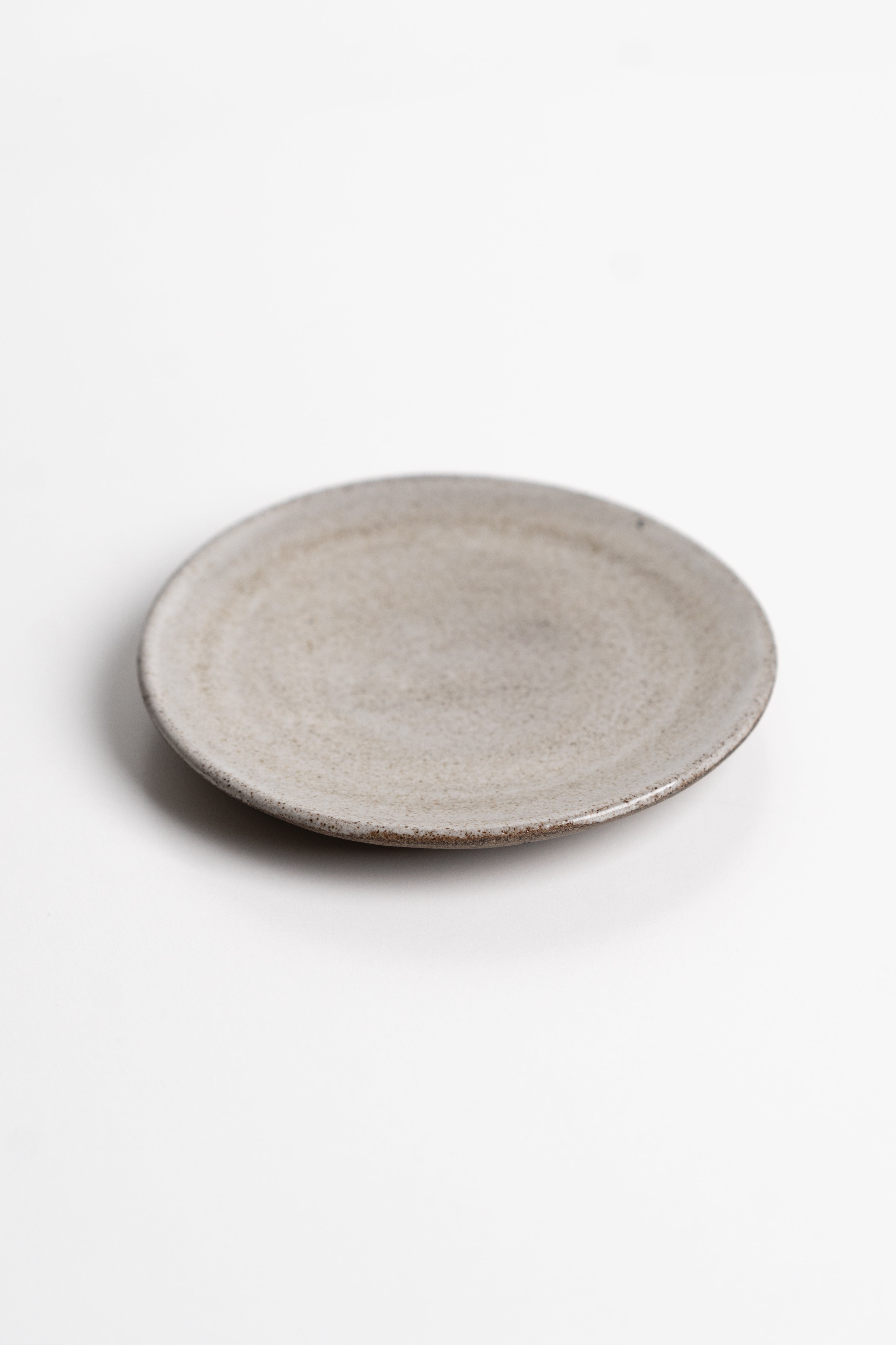 Round ceramic dish on a white background