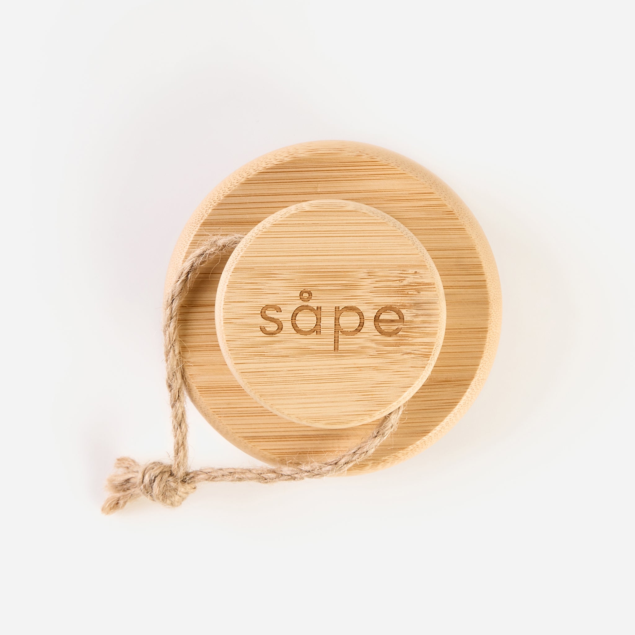 Overhead view of bamboo Body Brush with engraved Sape logo and hanging rope
