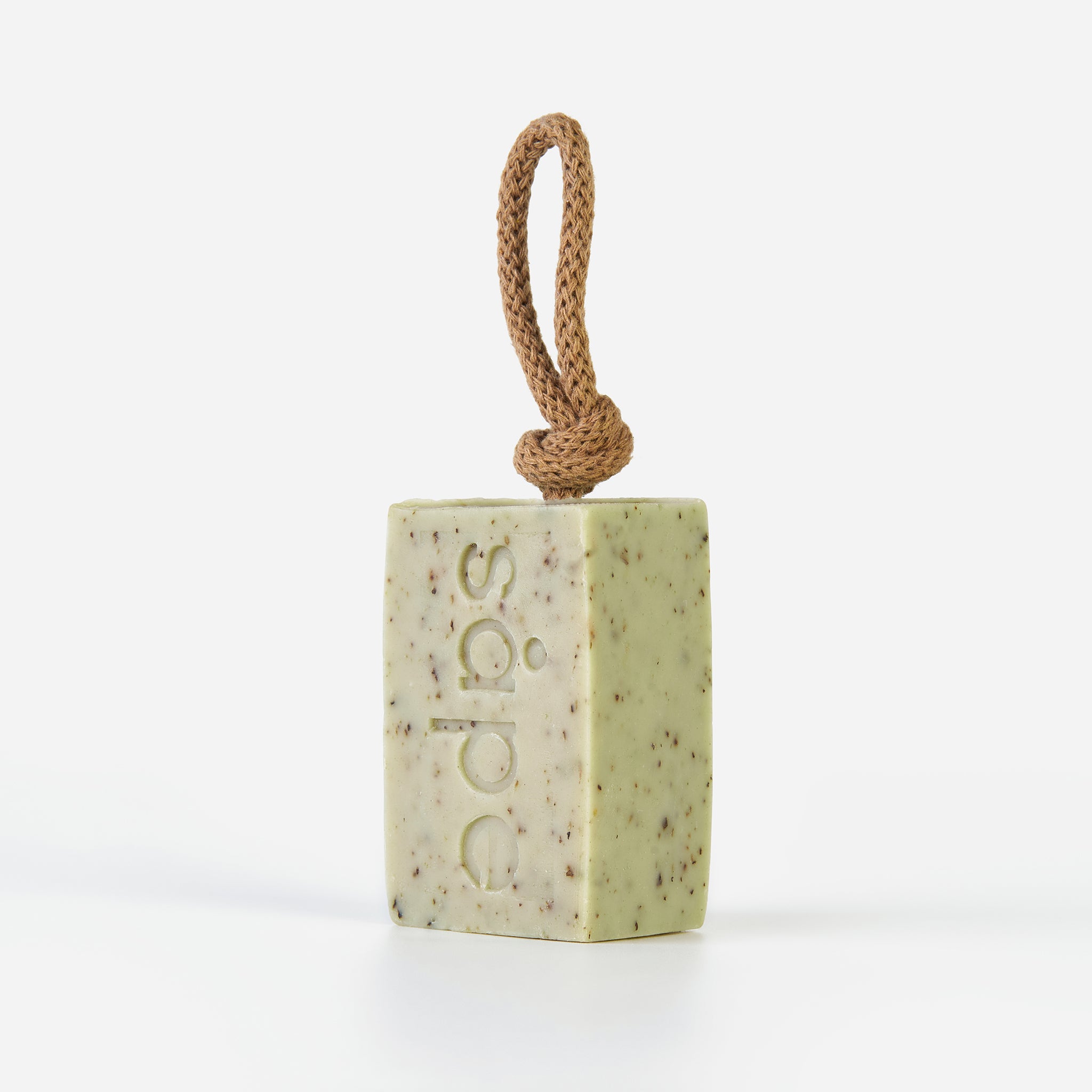 Side view of Frisk green clay soap bar showing rope and layered texture